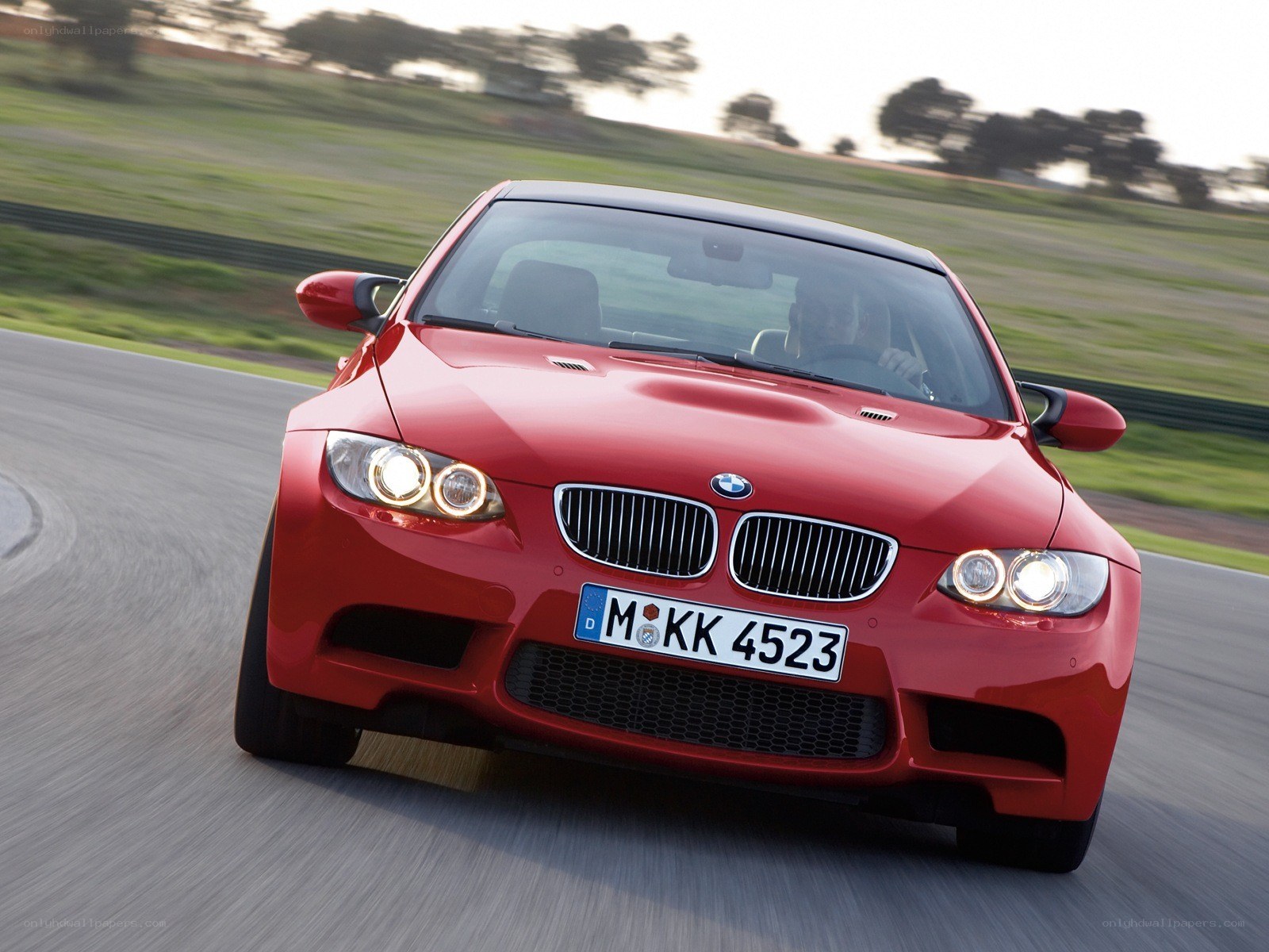 red bmw m3 on a racetrack