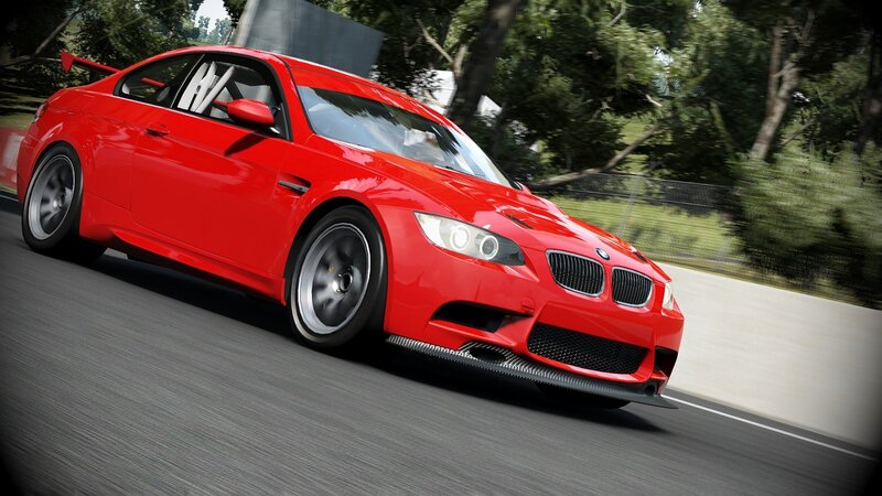 red bmw m3 on a racetrack