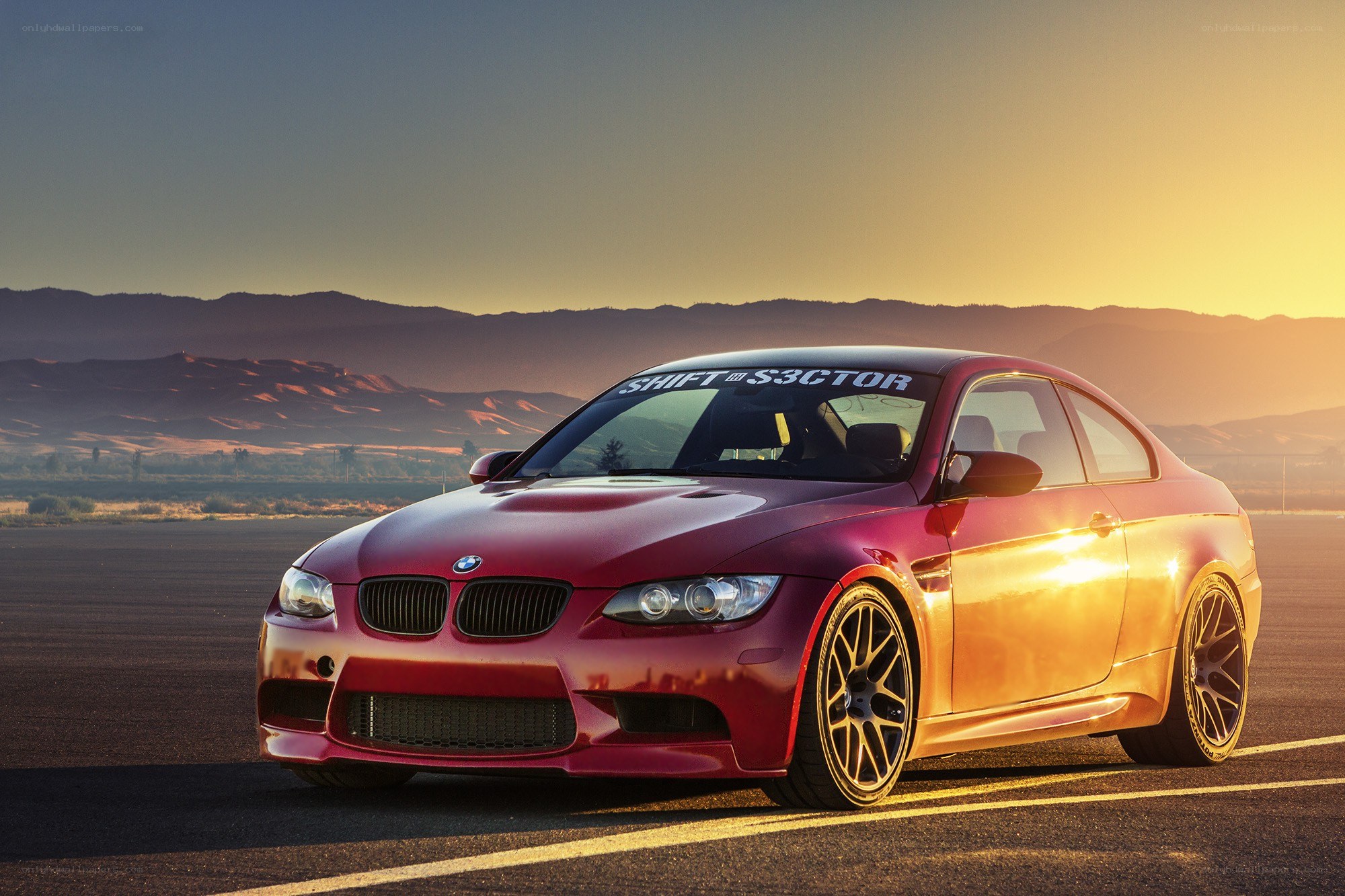 Red BMW M3 on a runway