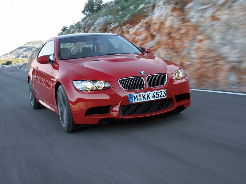 Red BMW M3 on a winding road