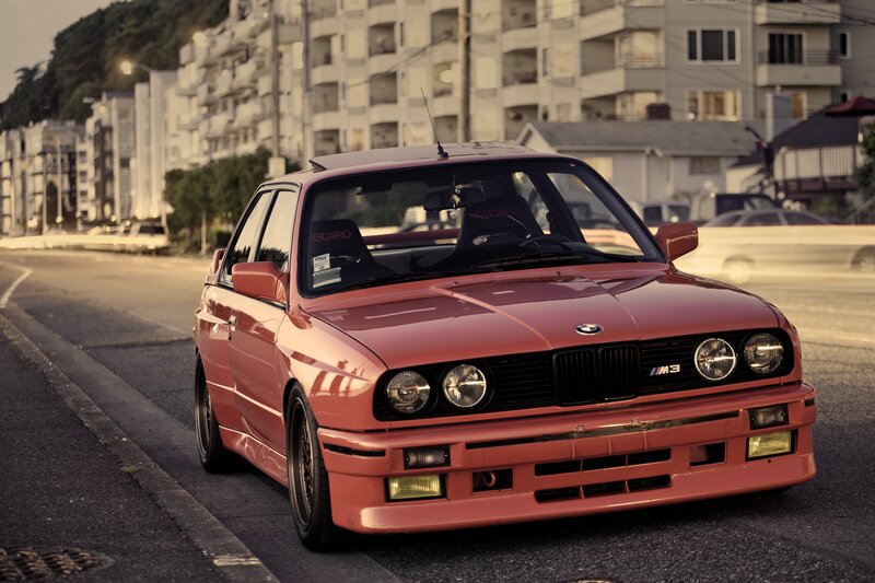 Red BMW M3 on city street