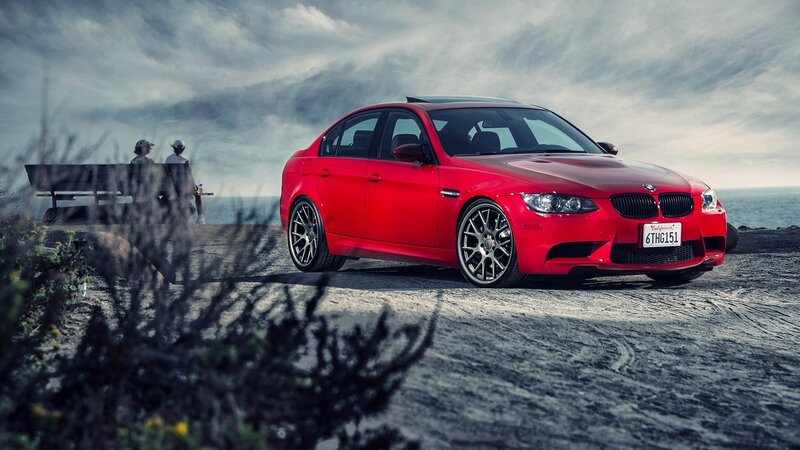 Red BMW M3 on coastal road