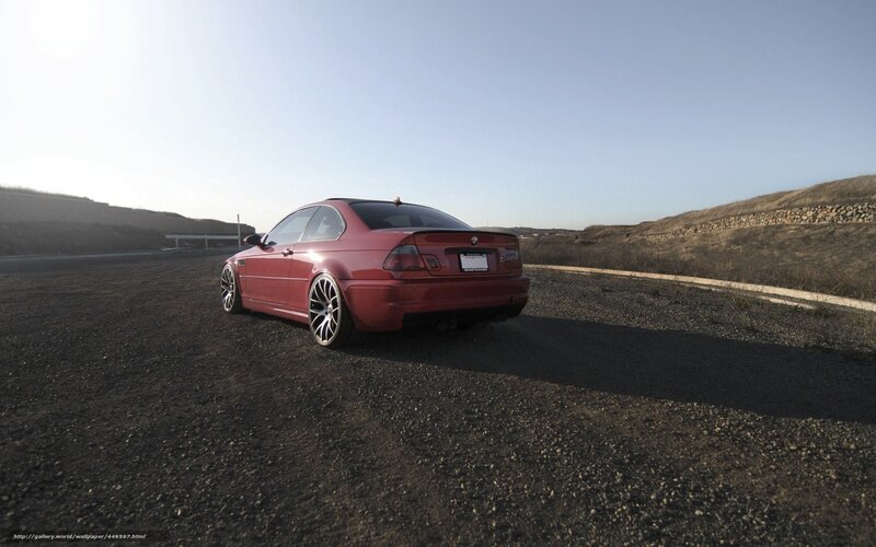 red bmw m3 on gravel