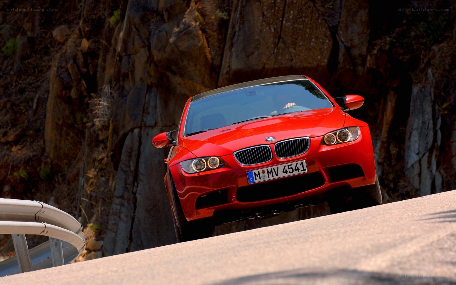 Red BMW M3 on mountain road