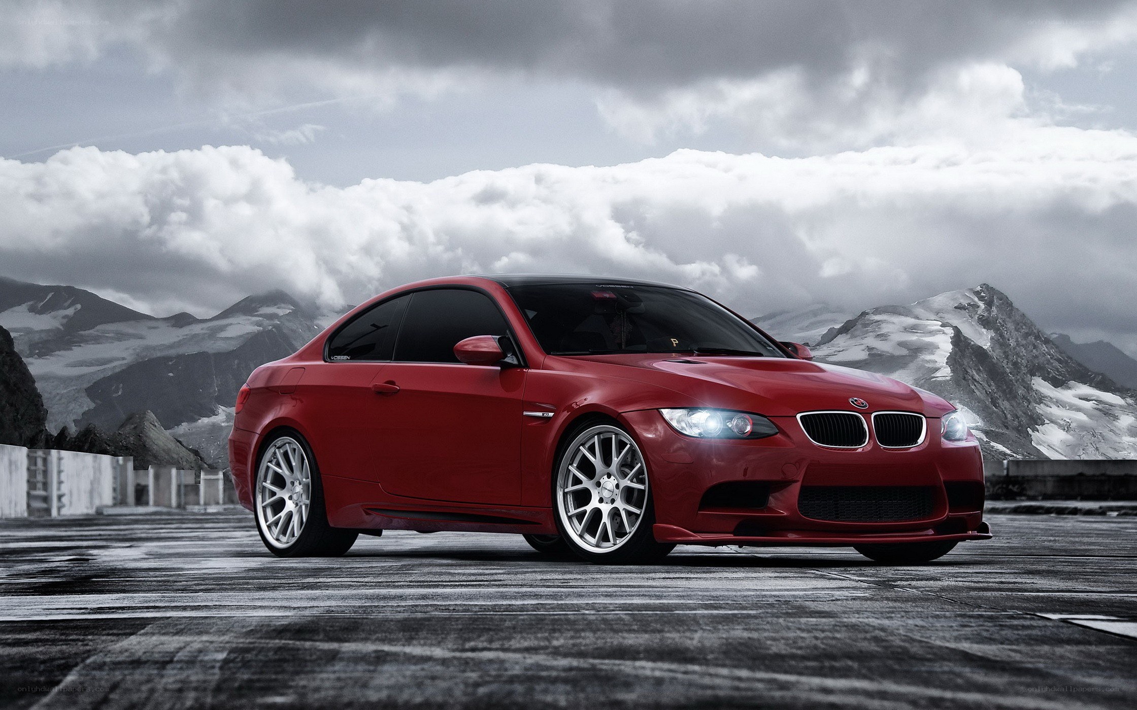 Red BMW M3 on mountain road