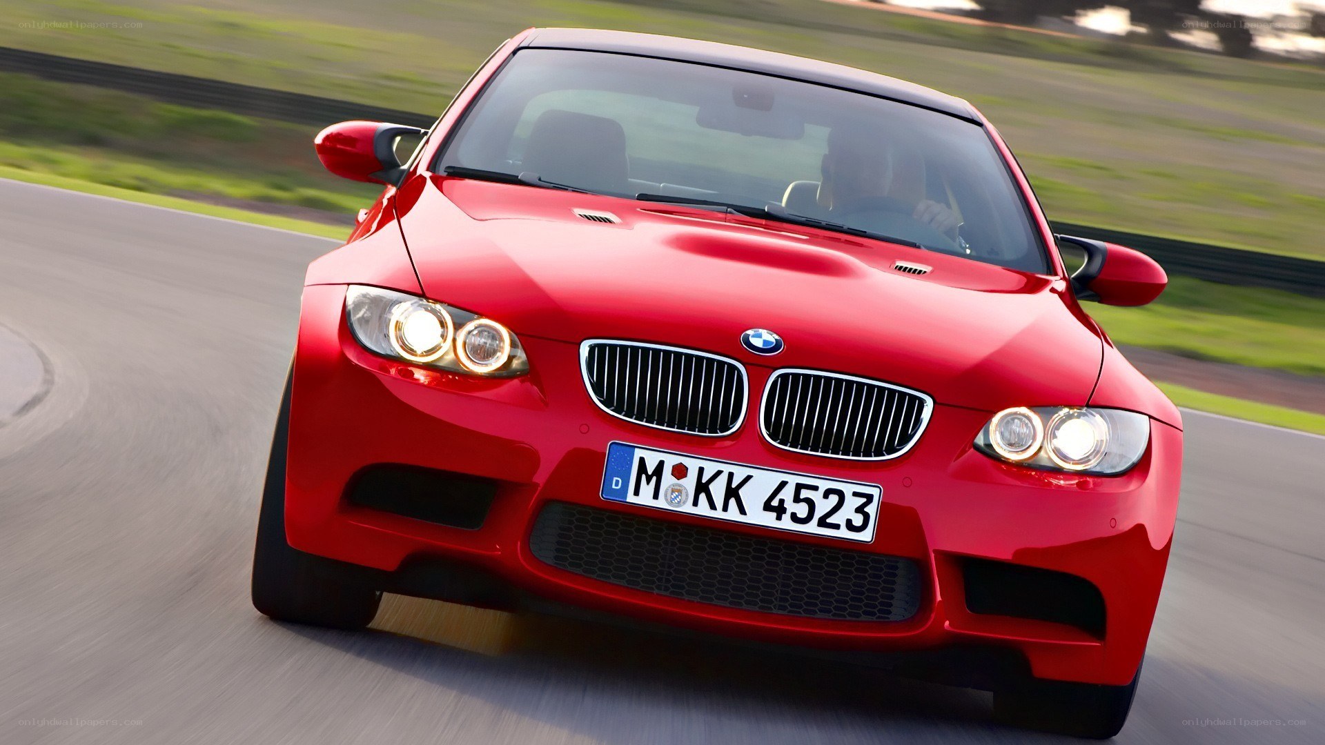 red bmw m3 on racetrack