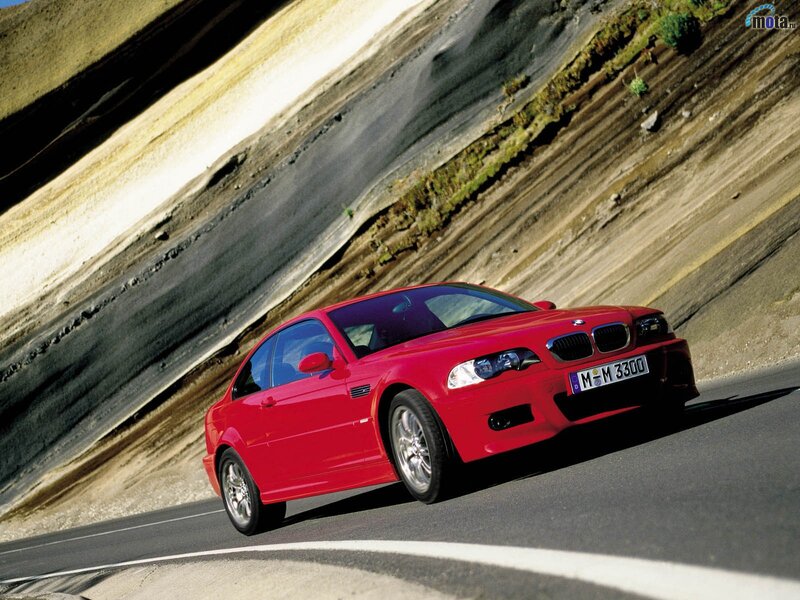 Red BMW M3 on winding road