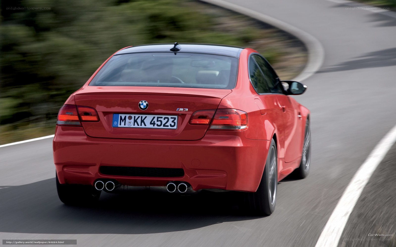 red bmw m3 on winding road