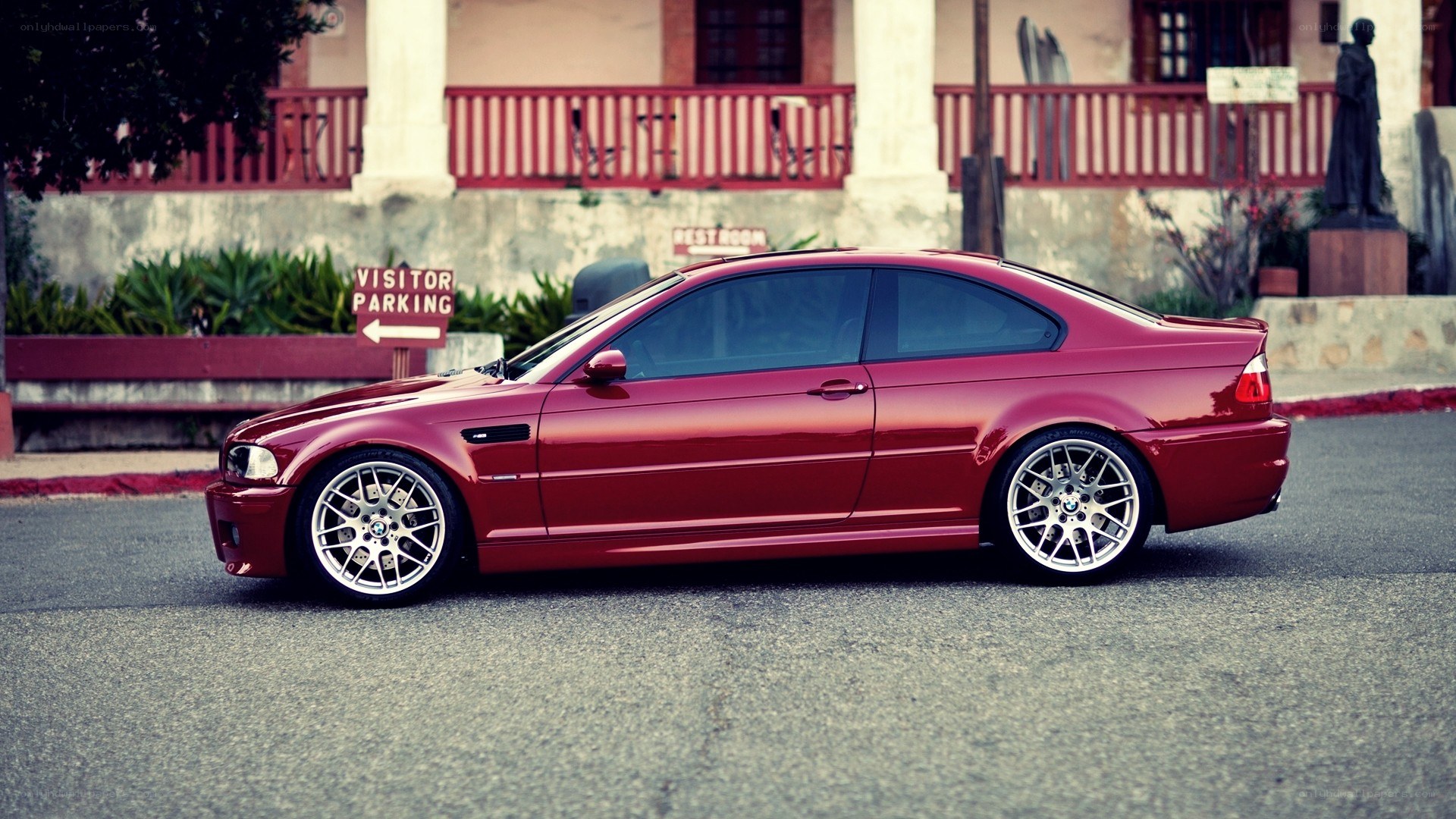 Red BMW M3 parked on street