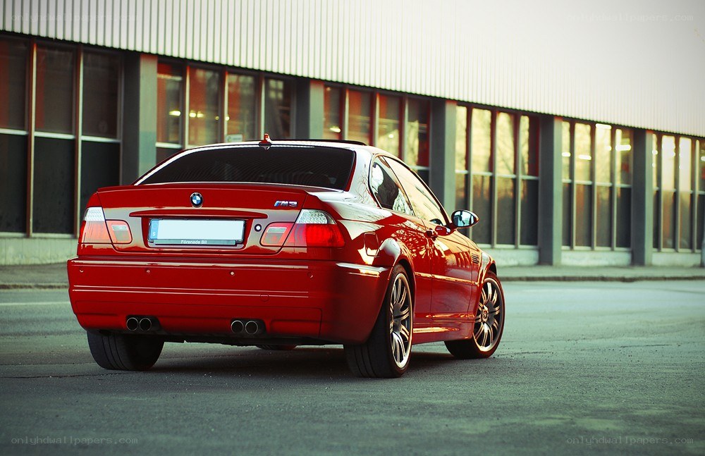 Red BMW M3 parked outside