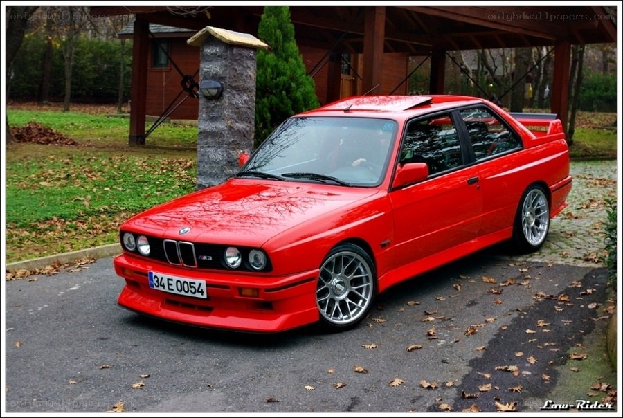 Red BMW M3 parked outside