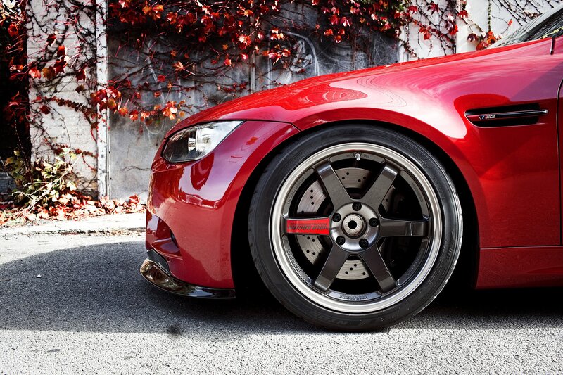 Red BMW M3 with custom wheels