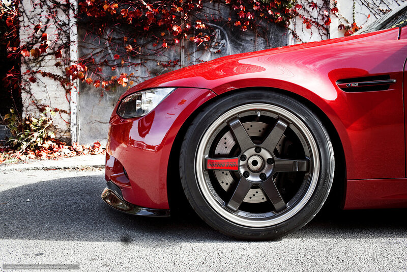 Red BMW M3 with custom wheels