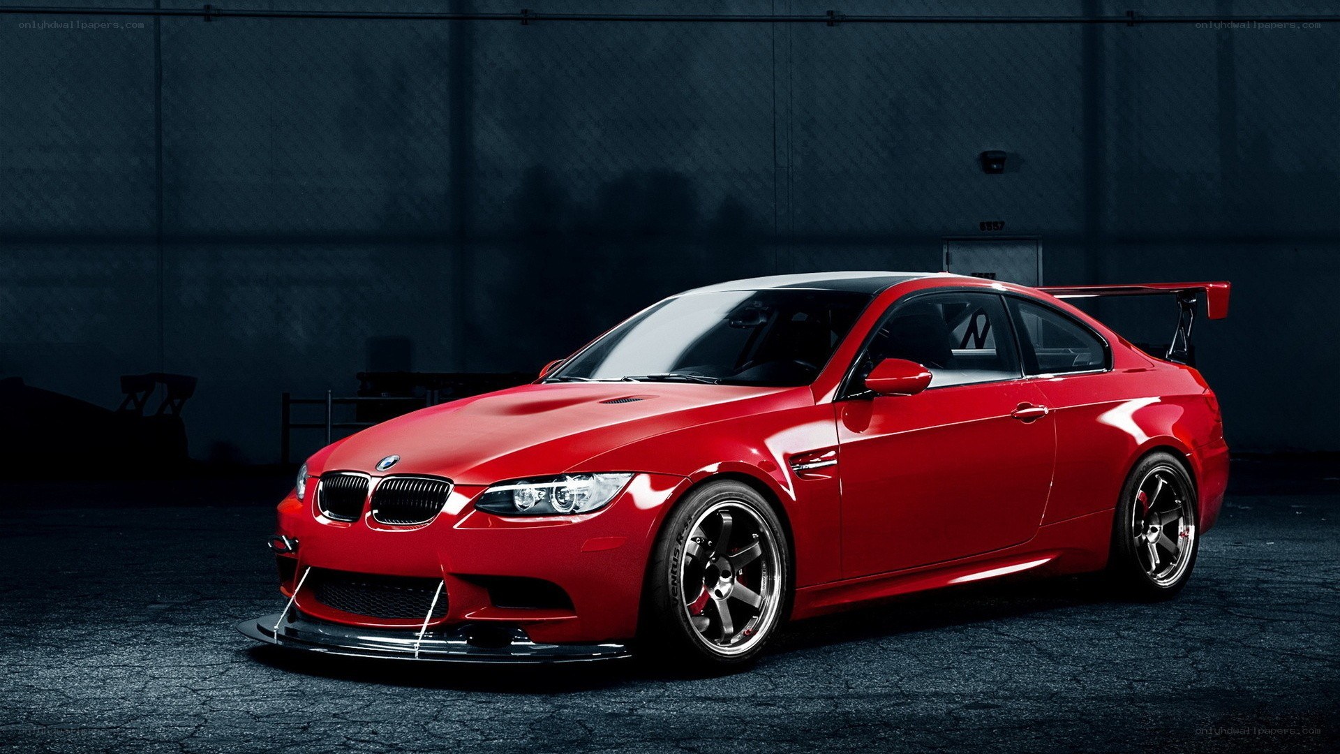 Red BMW M3 with rear wing