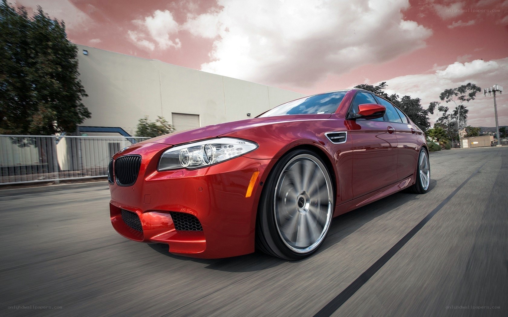 Red BMW M5 in motion