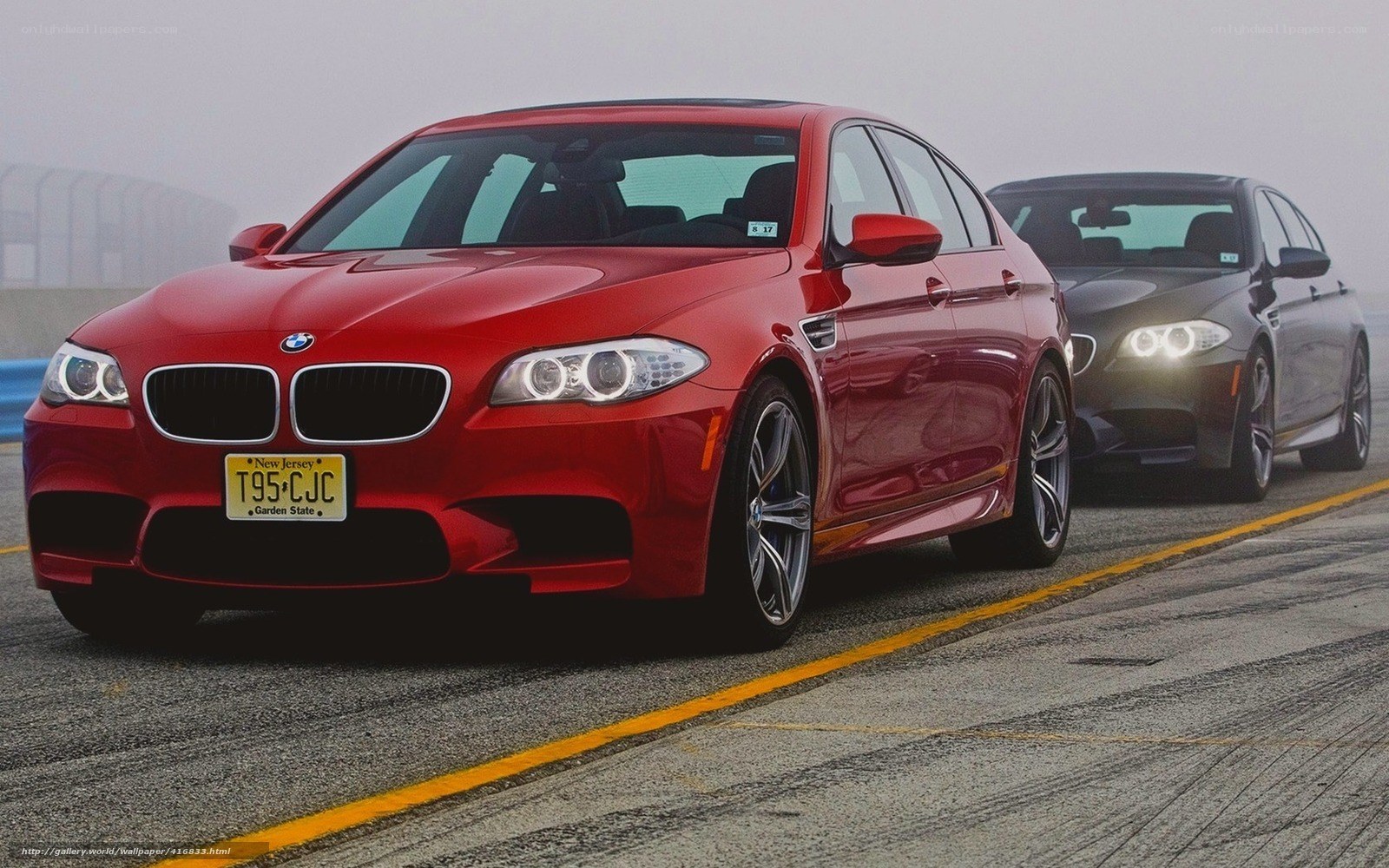 Red BMW M5 on a racetrack