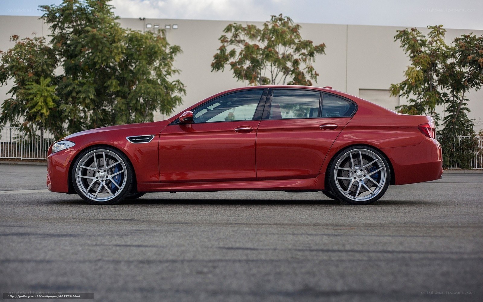 red bmw m5 sedan