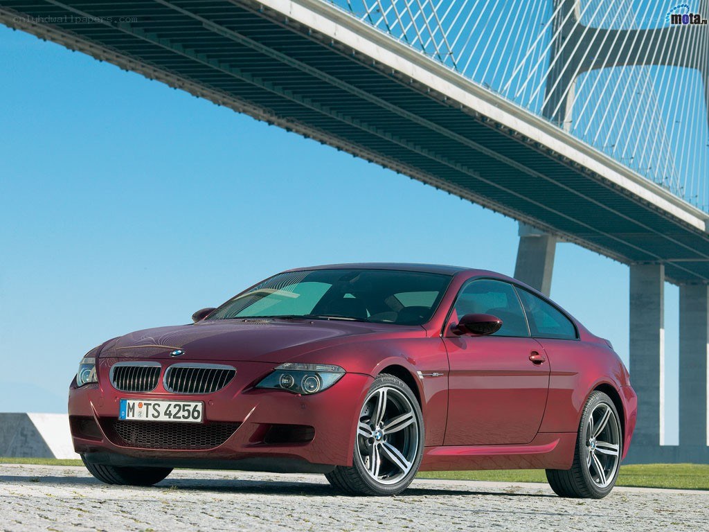 Red BMW M6 coupe under bridge