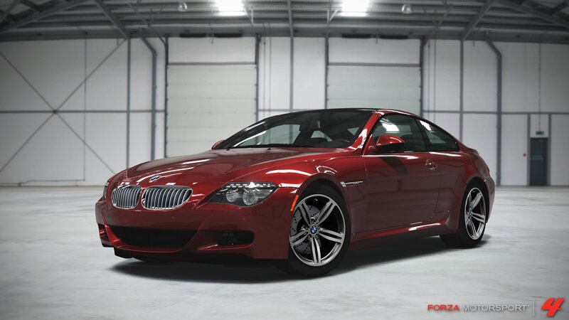 Red BMW M6 in a warehouse