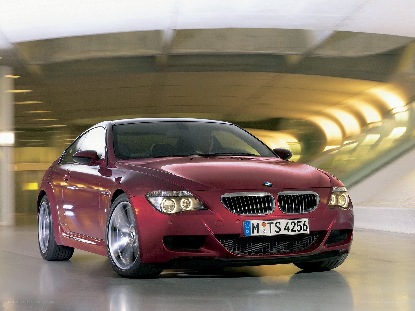 Red BMW M6 in motion