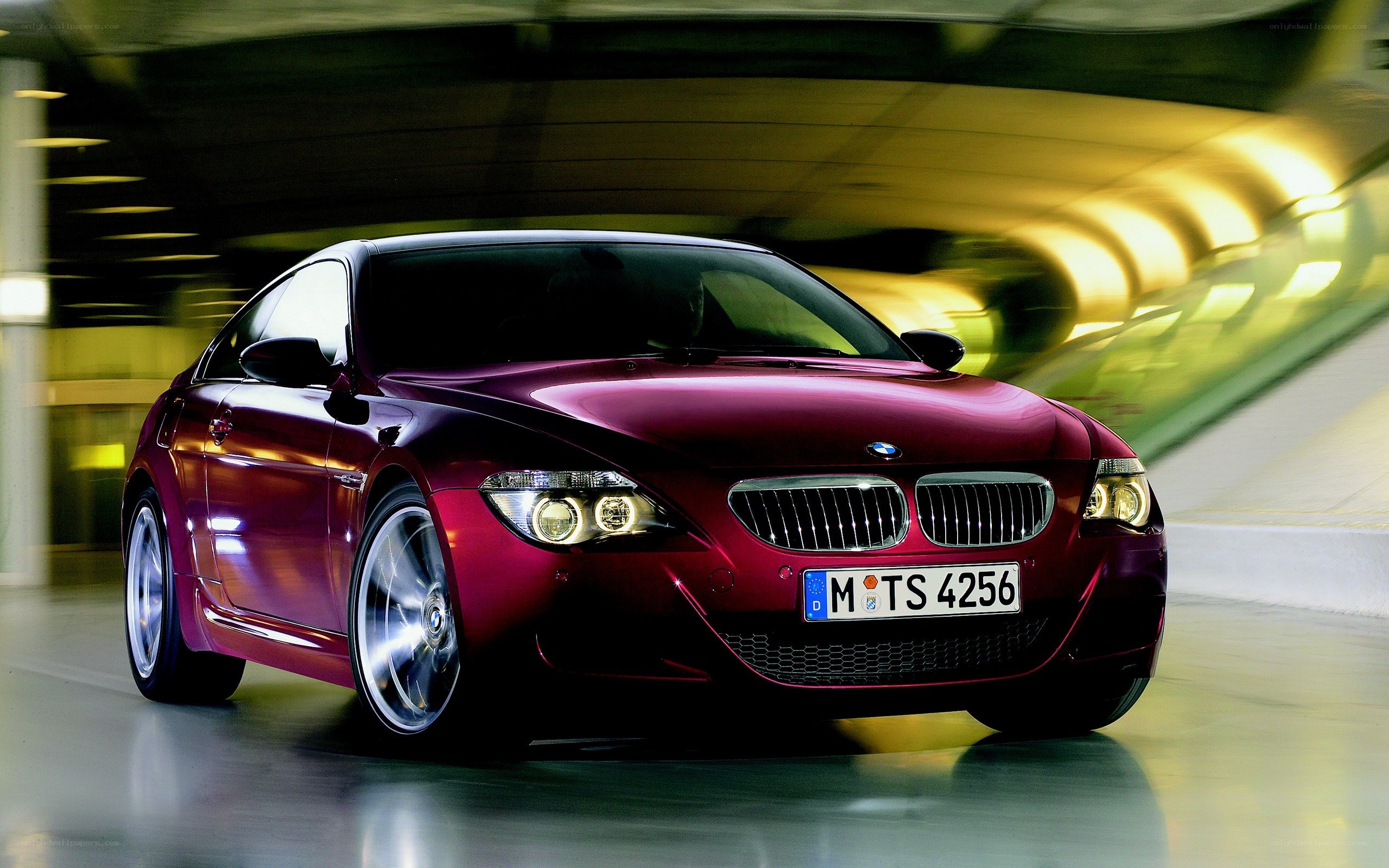 Red BMW M6 in motion