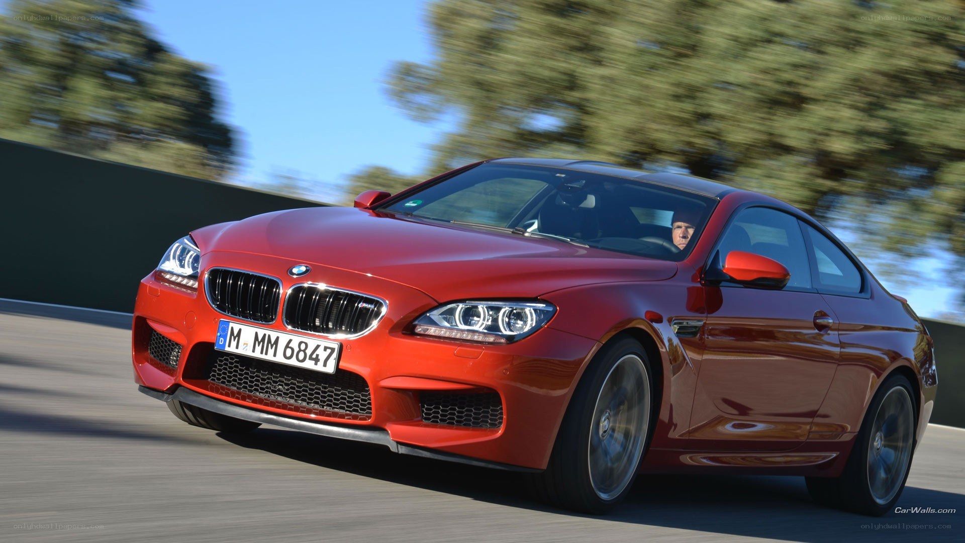 Red BMW M6 in motion