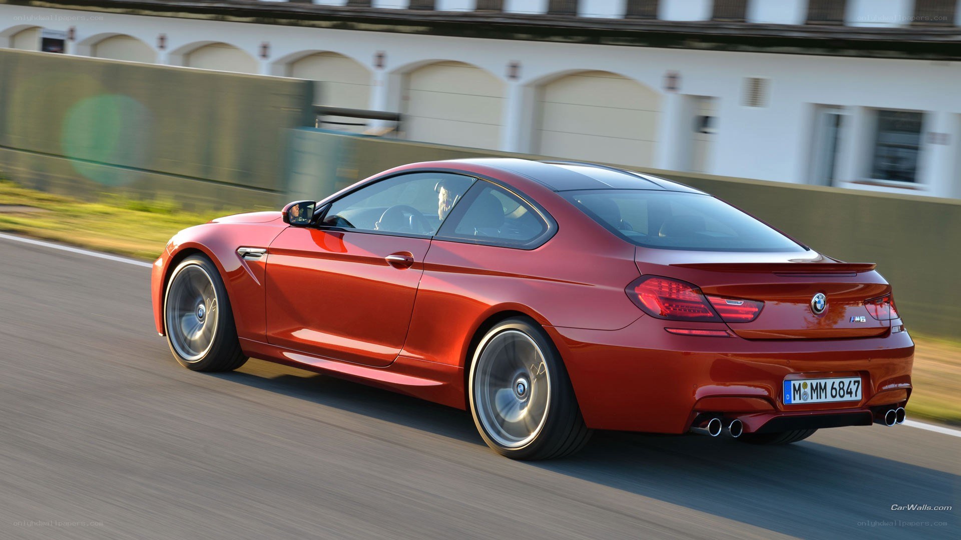 red bmw m6 in motion