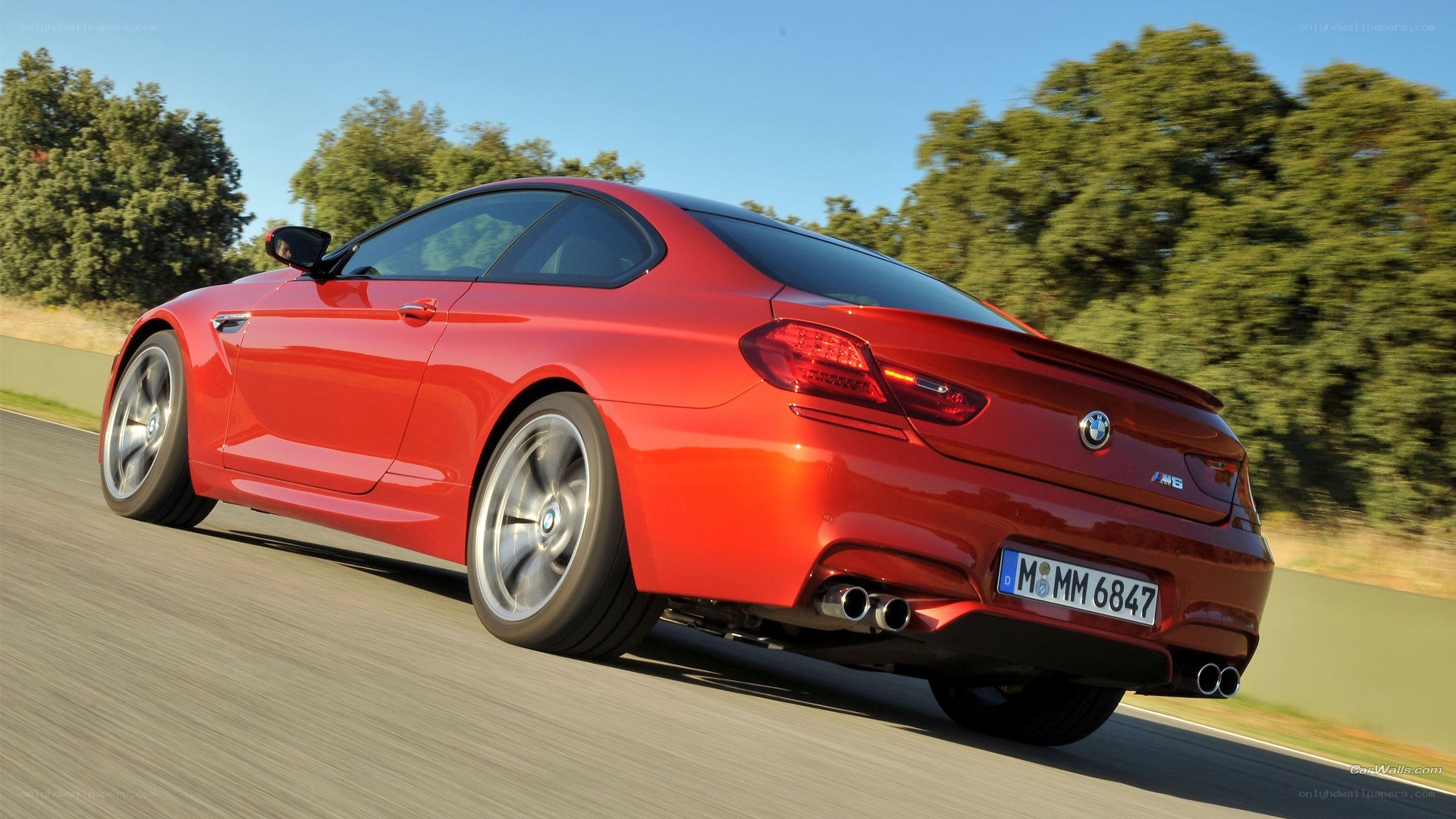Red BMW M6 in motion