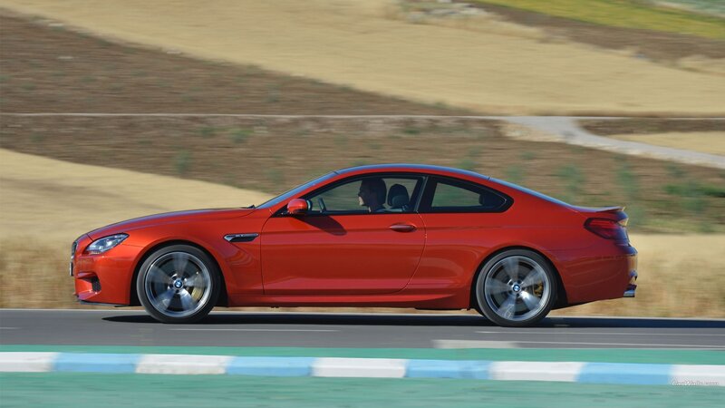 Red BMW M6 on a racetrack