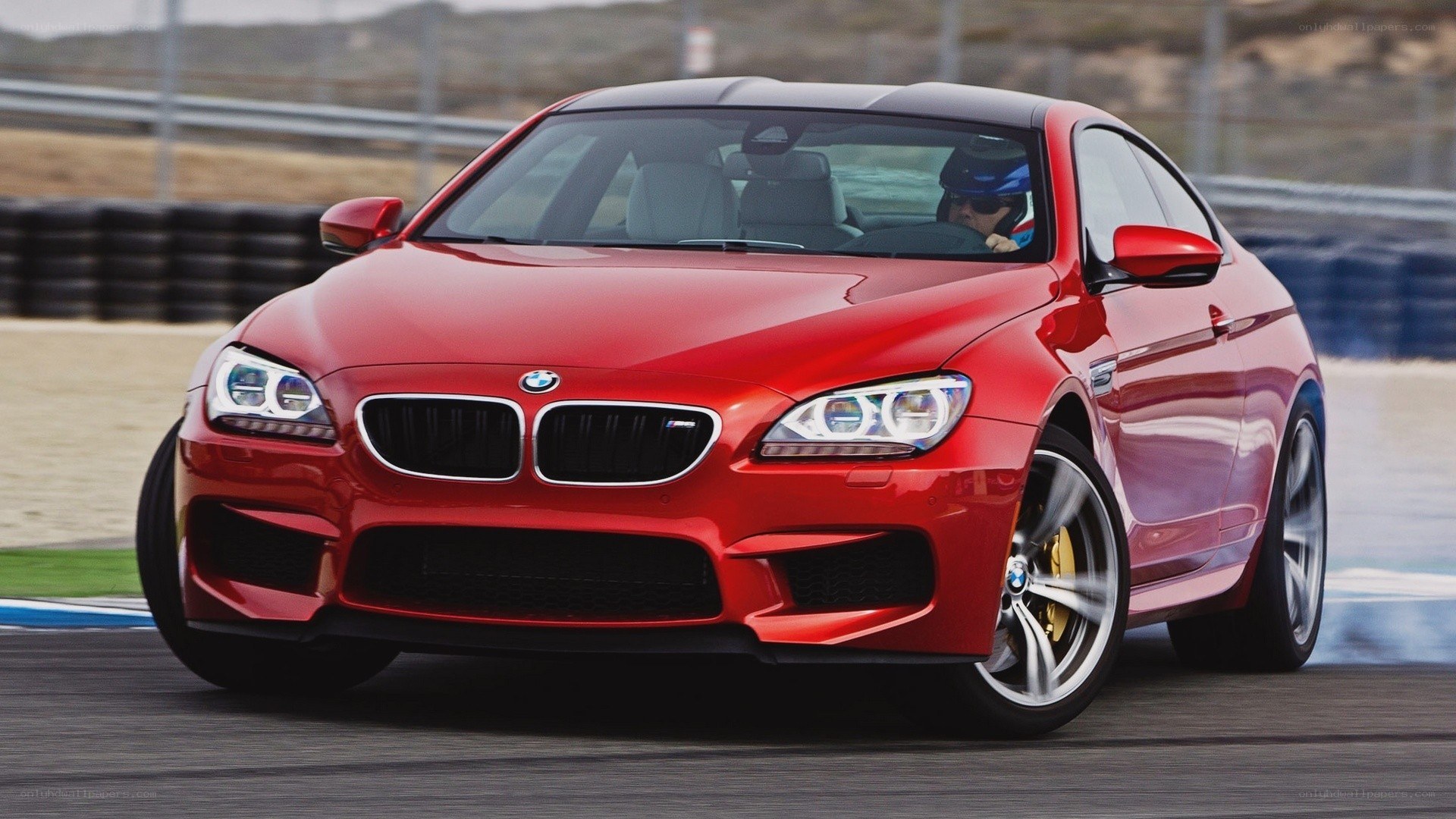 Red BMW M6 on a racetrack