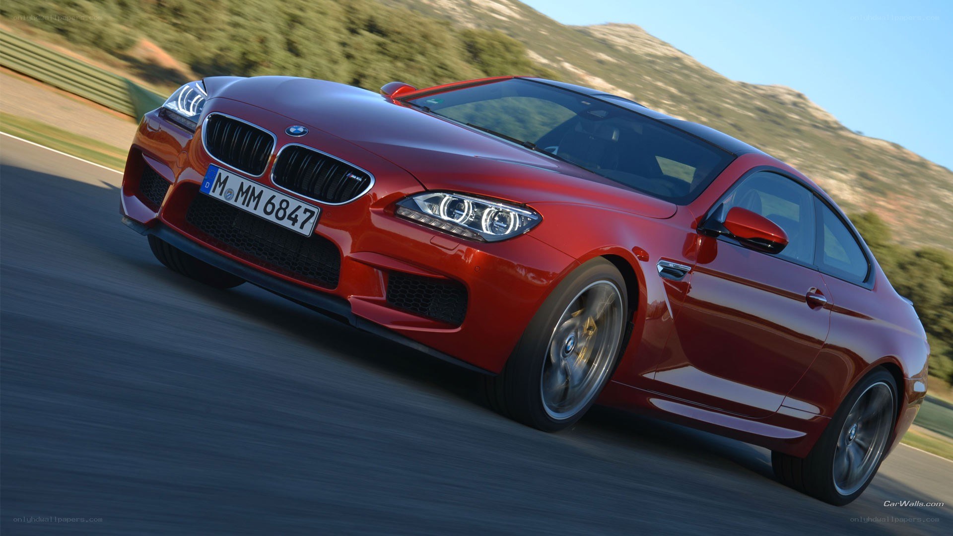 red bmw m6 on a racetrack