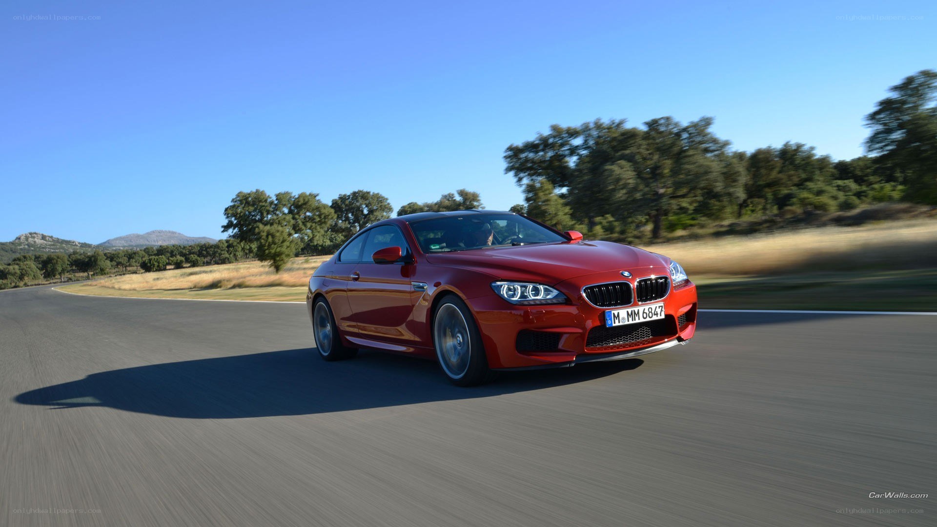 Red BMW M6 on a road
