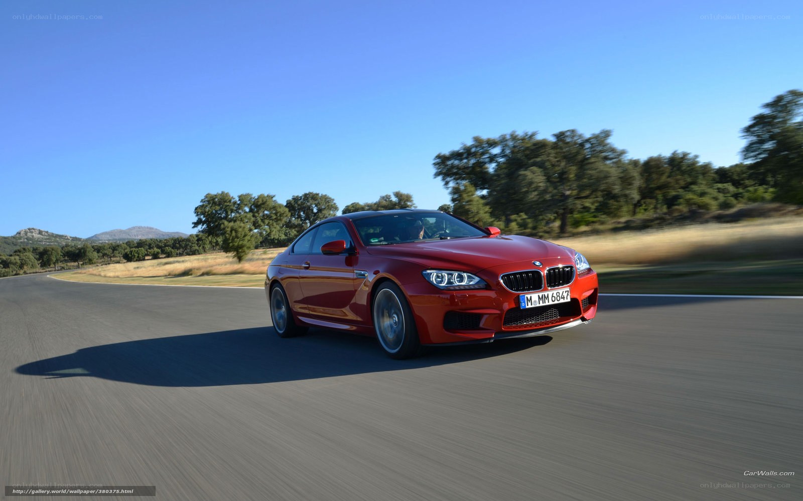 red bmw m6 on a road