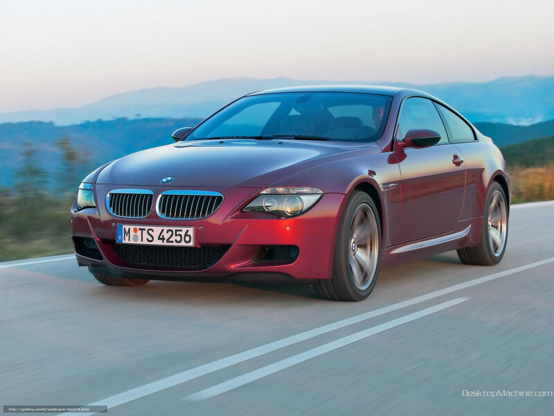 Red BMW M6 on a scenic road