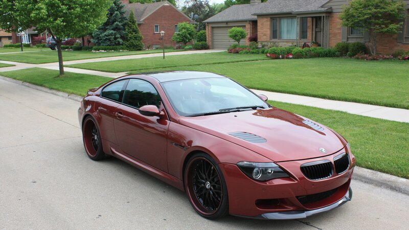 Red BMW M6 on a suburban street