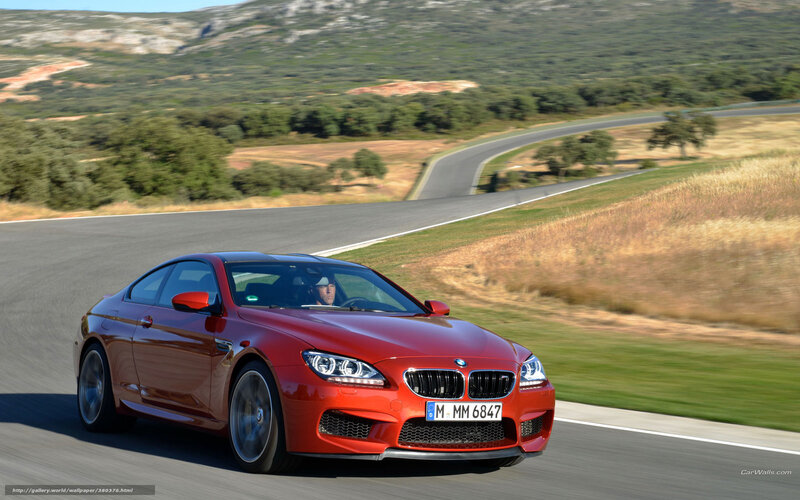 Red BMW M6 on a winding road