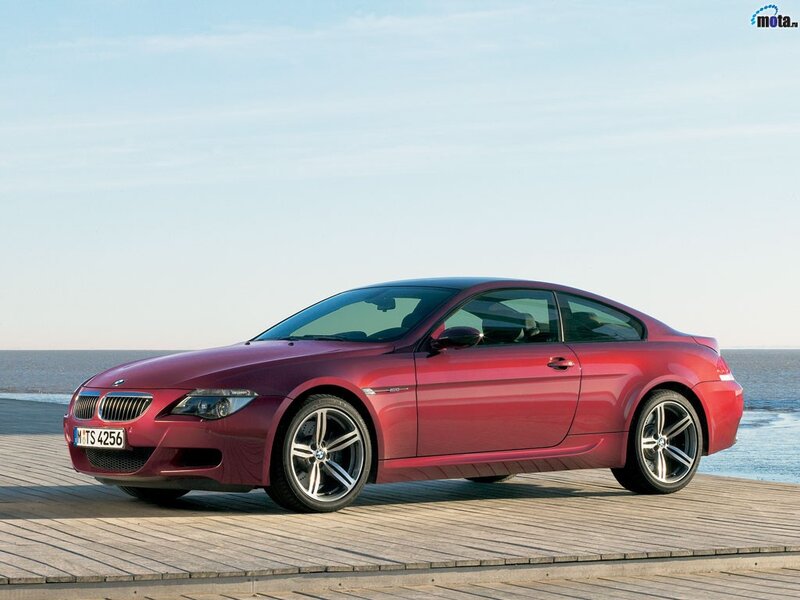 Red BMW M6 on a wooden pier