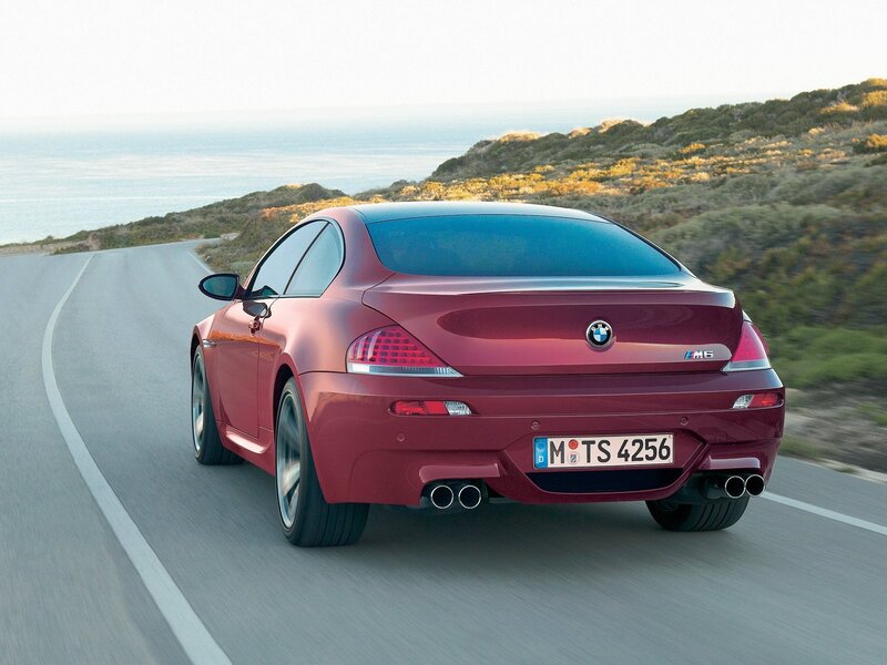Red BMW M6 on coastal road