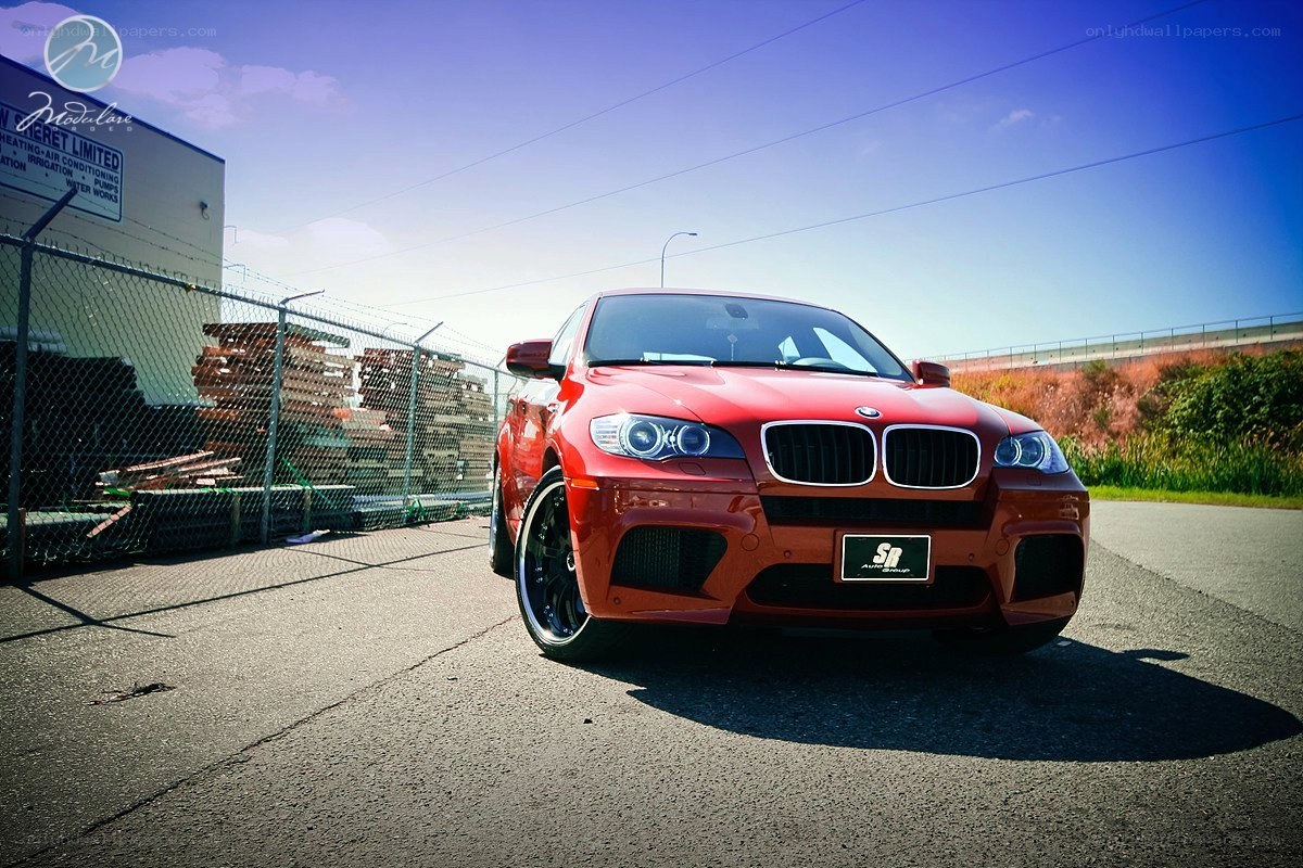 Red BMW M6 parked outside