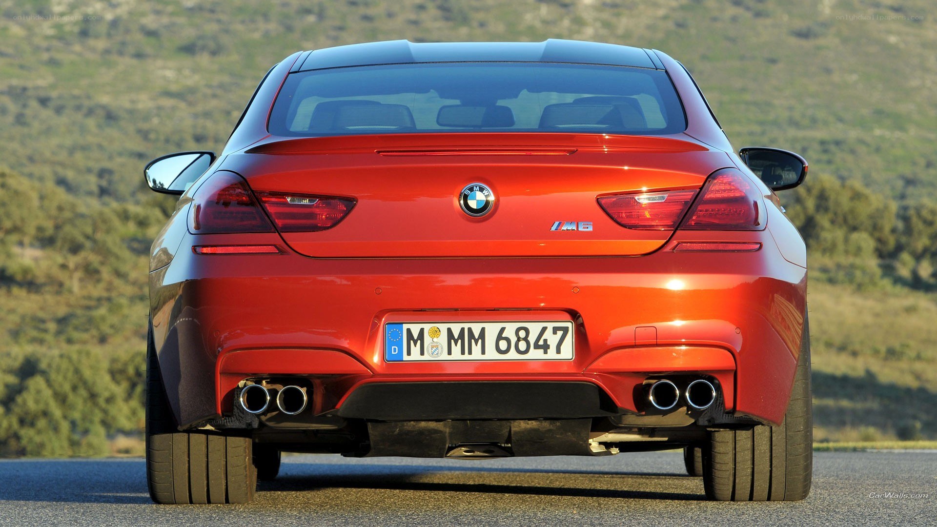 Red BMW M6 rear view