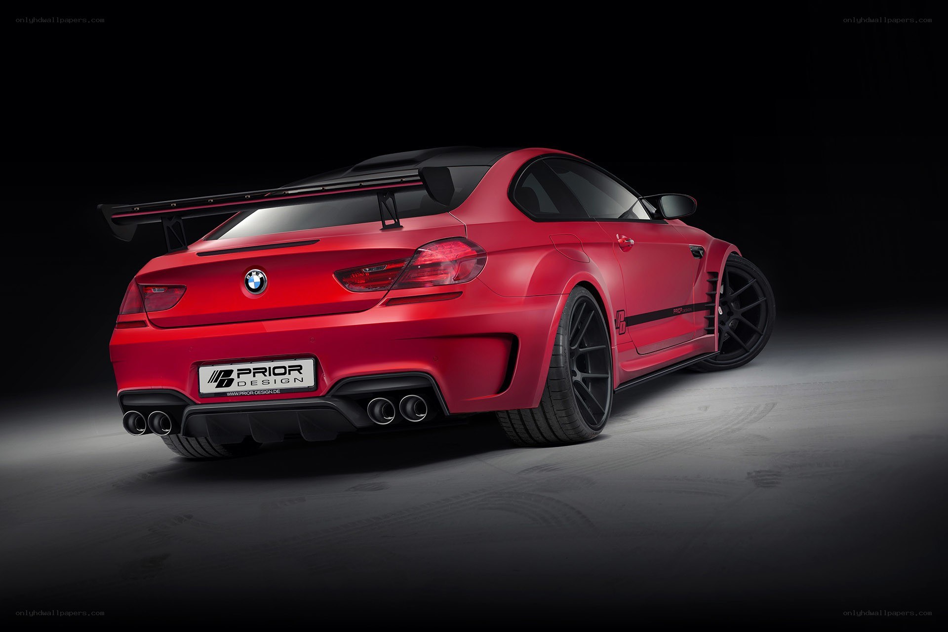 red bmw m6 with prior design kit