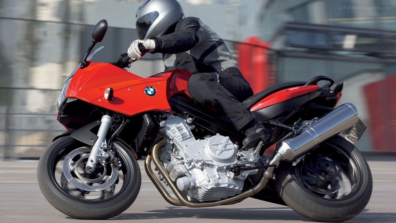 Red BMW motorcycle in motion