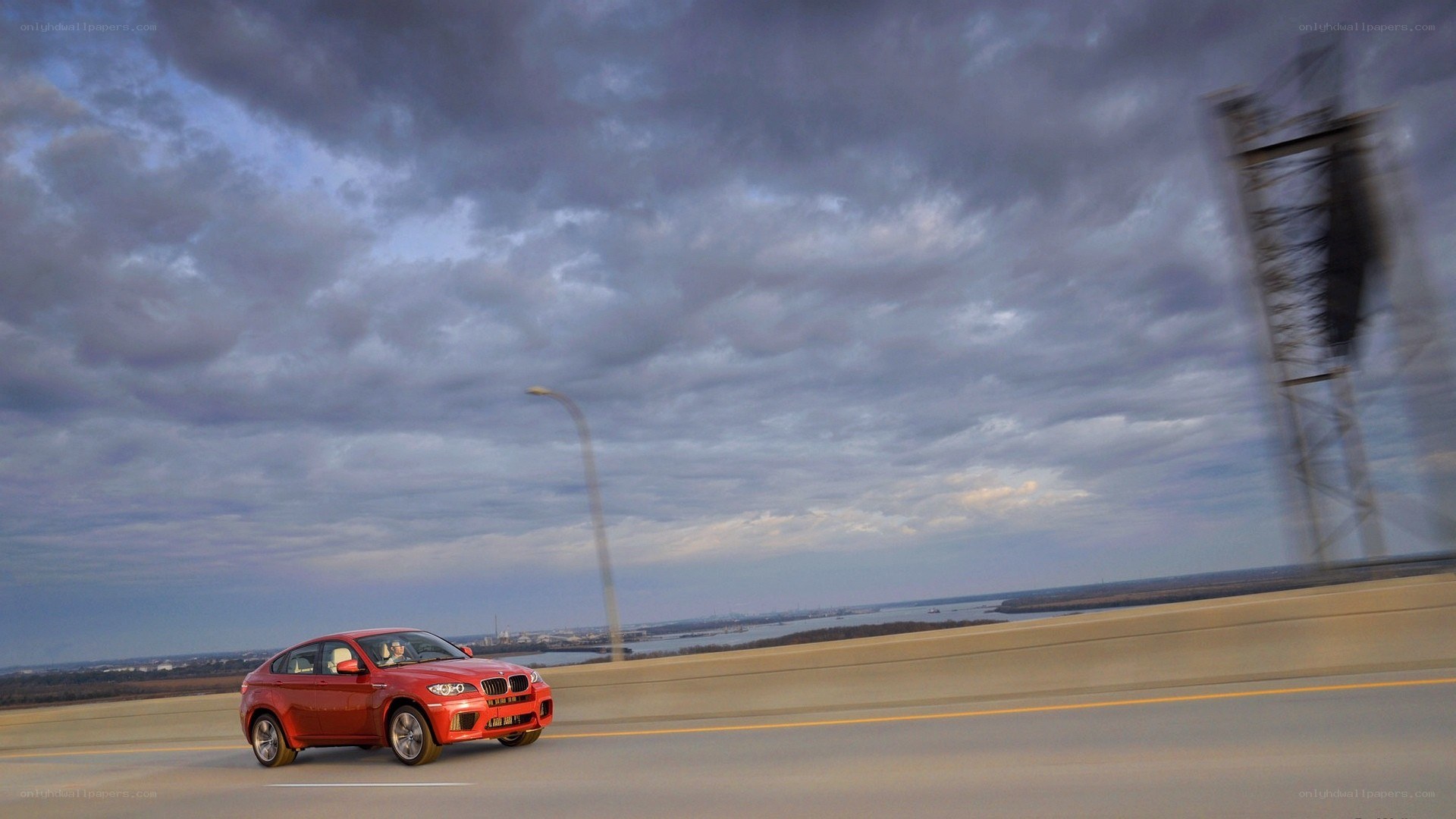 Red BMW on a highway