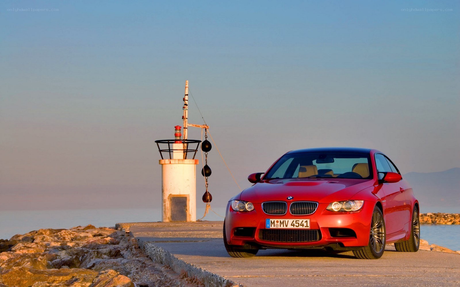 Red BMW on a pier