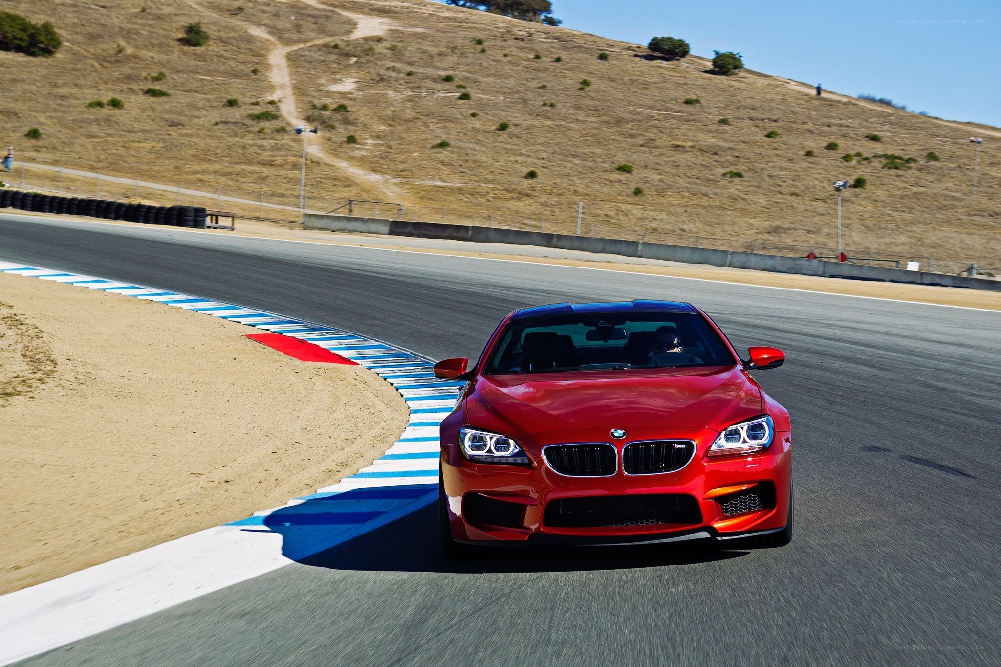 Red BMW on a racetrack