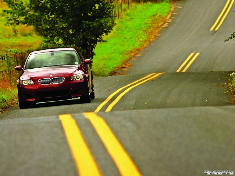 red bmw on a winding road