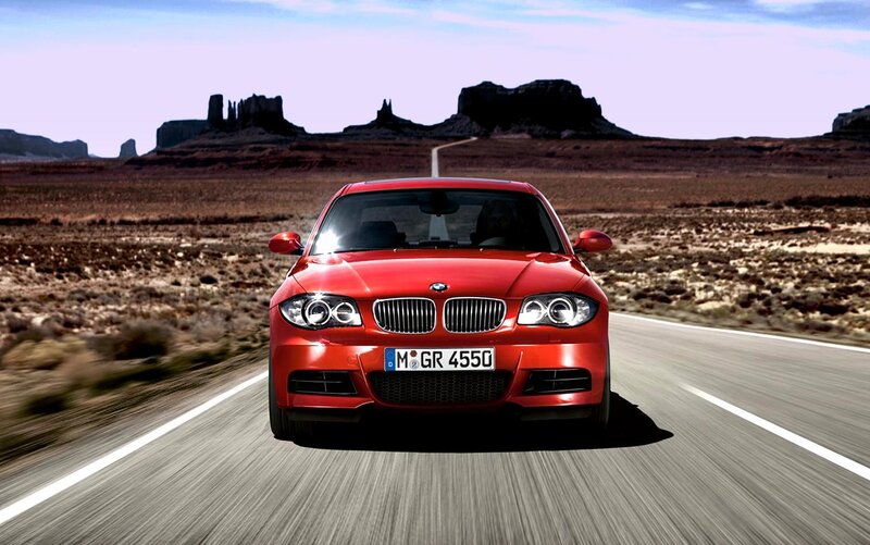 Red BMW on desert road