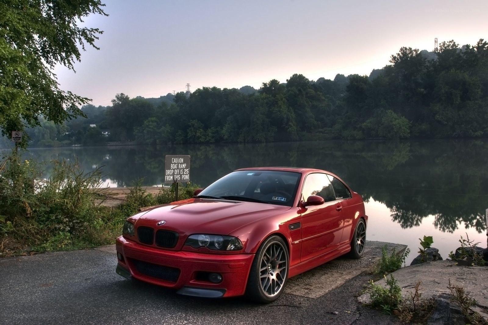 Red BMW on lakeside