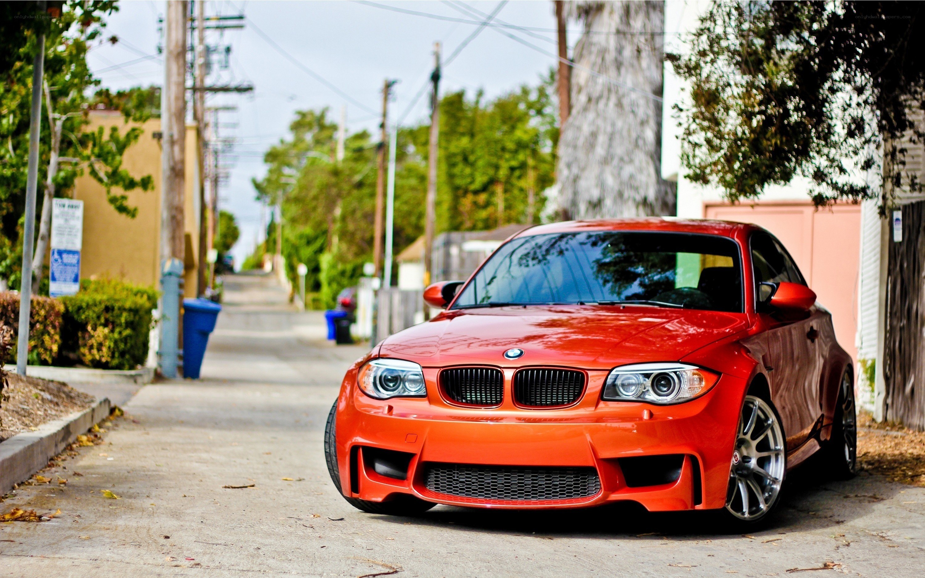 Red BMW parked on a street