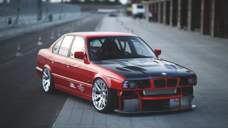 Red BMW race car on track